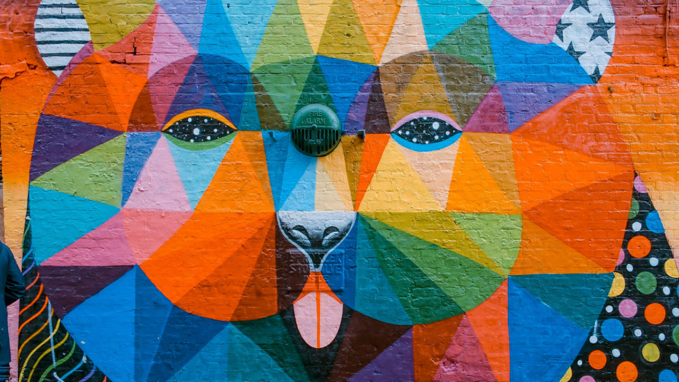 A multicolored mural of a lion.