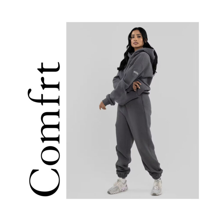 Comfrt hoodie and sweatpants on a posed model (female presenting)